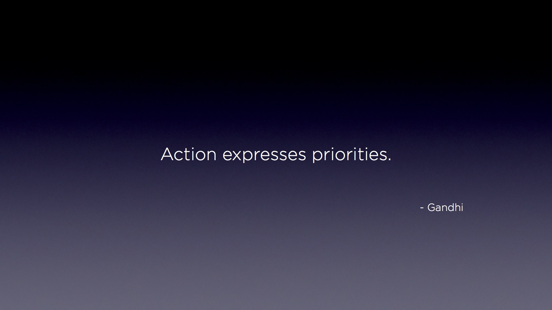 "Action expresses priorities" - Gandhi Desktop Wallpaper Quote