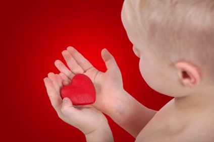 Baby Holding Heart